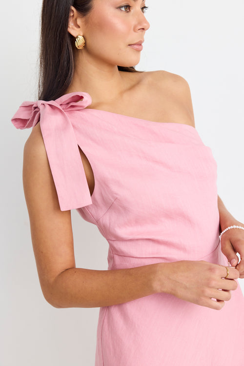 model wears a one shoulder pink mini dress