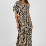 model wears a navy floral one shoulder maxi dress