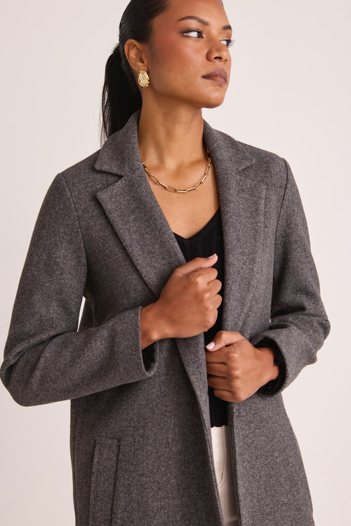 model wears a Grey Wool Coat 