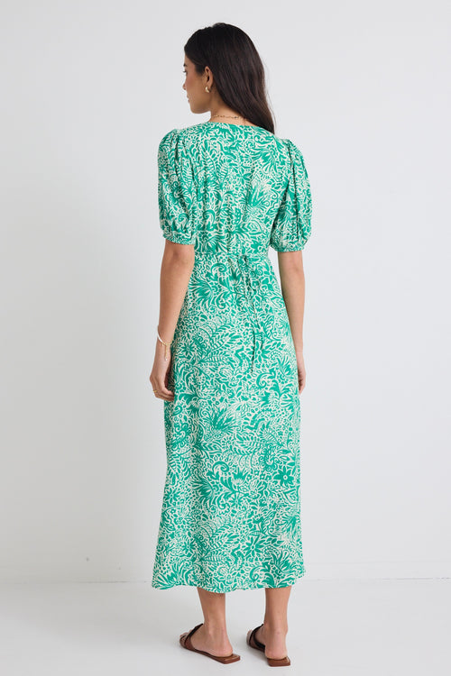 model wears floral green midi dress