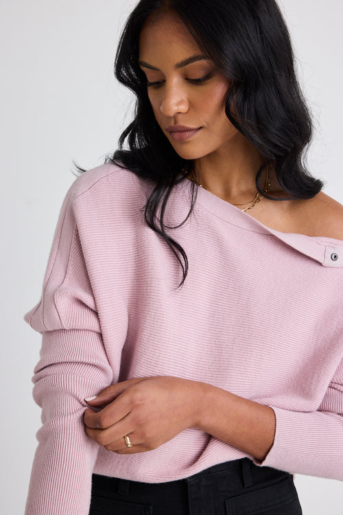 Model wears a pink batwing jumper