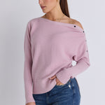 Model wears a pink batwing jumper