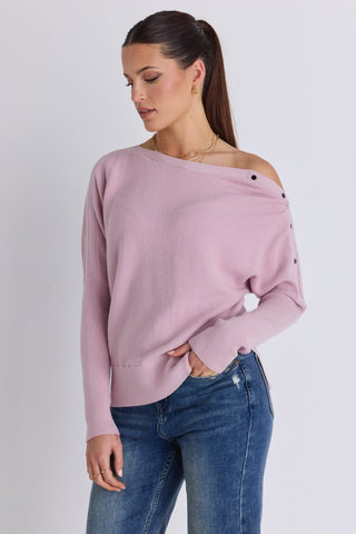 Model wears a pink batwing jumper