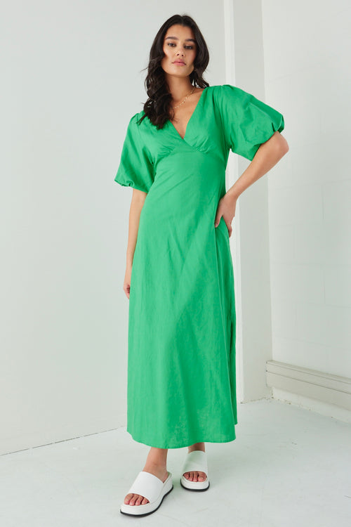 Model wears a linen puff sleeve green maxi dress 