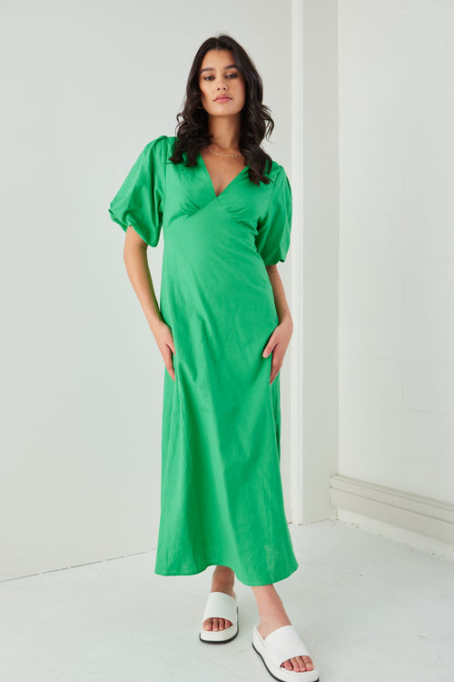 Model wears a linen puff sleeve green maxi dress 