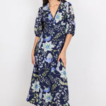 Woman wearing a floral dress on a white background