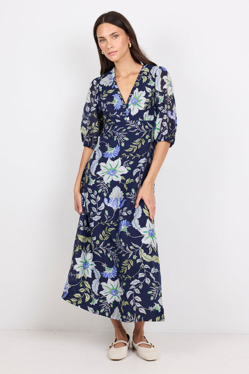 Woman wearing a floral dress on a white background