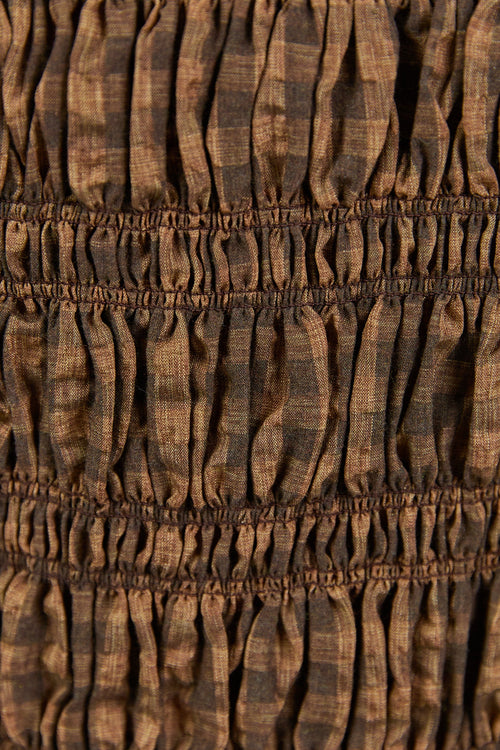 Close-up of brown fabric with a textured pattern