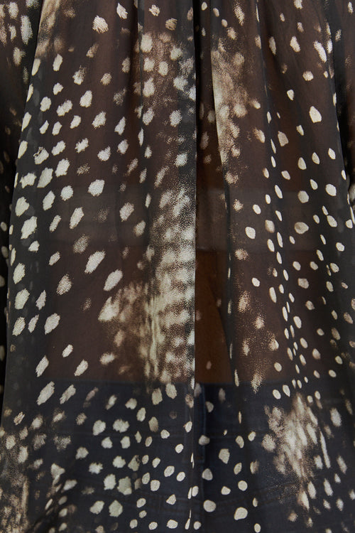 Close up of sheer patterned top.