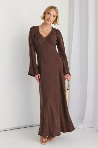 model wears a brown long sleeve maxi dress