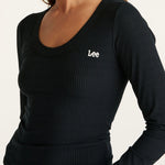 Model wears a Long Sleeve Black Top