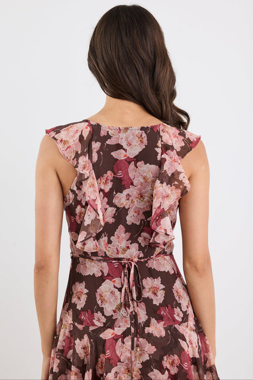 Woman wearing a floral dress on a white background