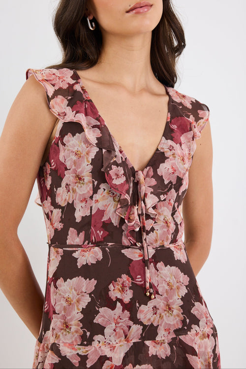 Woman wearing a floral dress with a white background