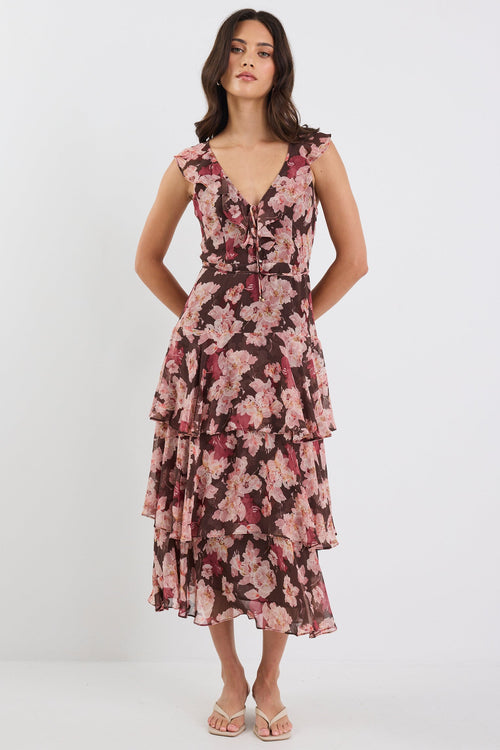 Woman wearing a floral dress on a white background