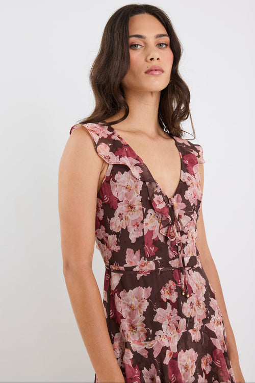 Woman wearing a floral dress on a white background