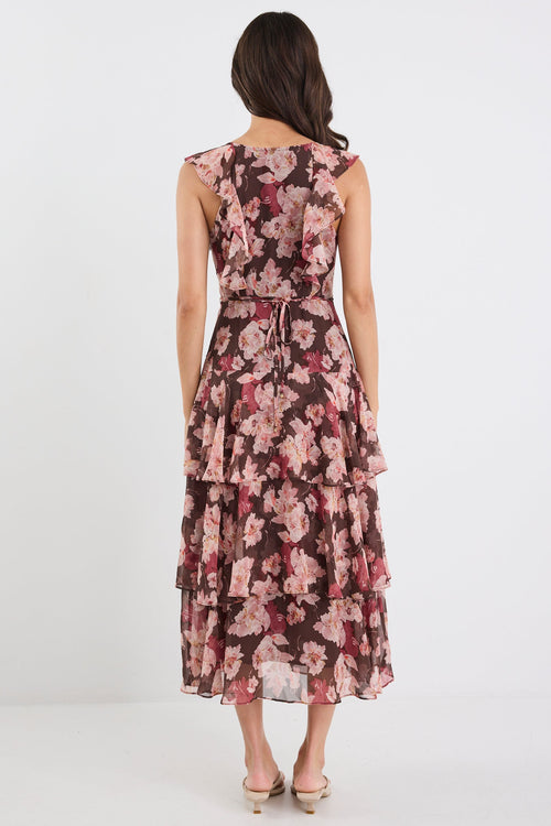 Woman wearing a floral dress on a white background