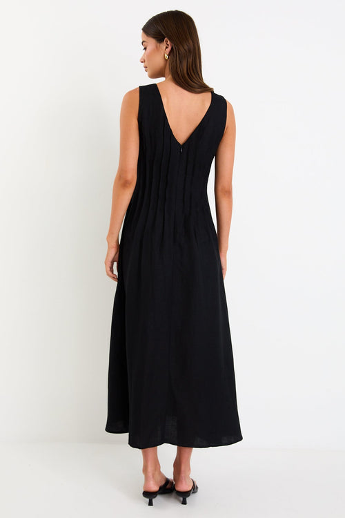 Woman wearing a black linen dress 