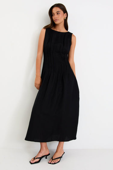 Woman wearing a black linen dress 