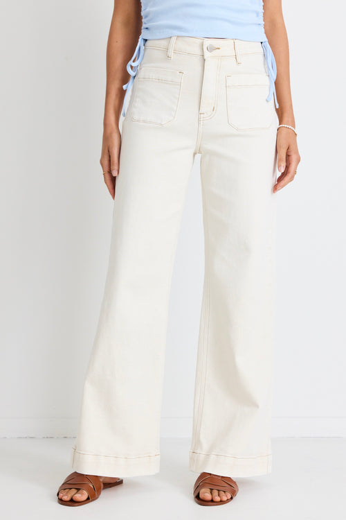 model wears white wide leg jeans