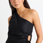 model wears a one shoulder black linen top