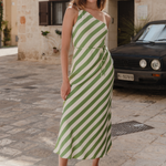 model wears green stripe bias cut slip dress