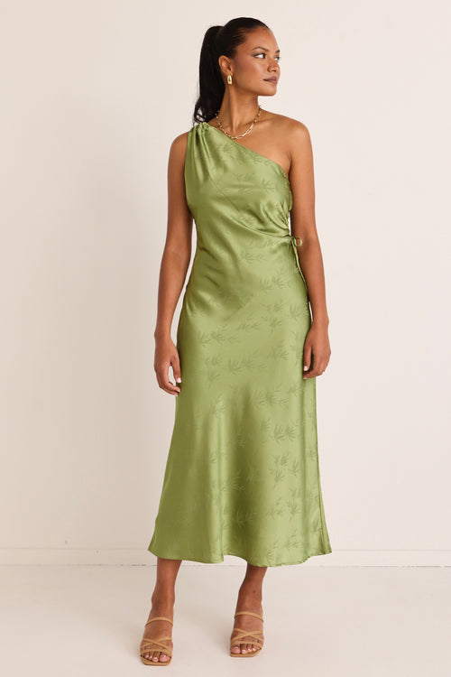 model wears a green one shoulder midi dress