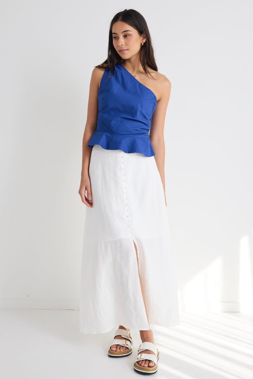 model wears white cotton linen midi skirt and blue top