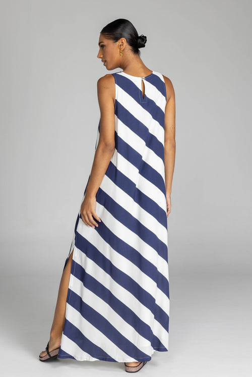 model wearing a navy and white striped maxi dress