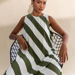 model wears a green and white stripe maxi dress