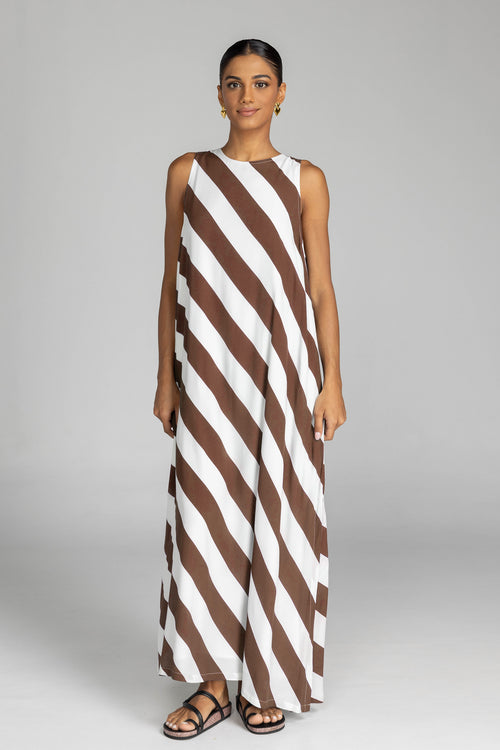 model wearing chocolate and white striped maxi dress