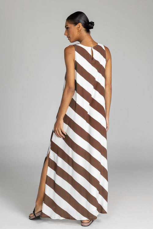 model wearing chocolate and white striped maxi dress