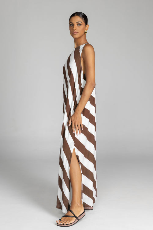model wearing chocolate and white striped maxi dress