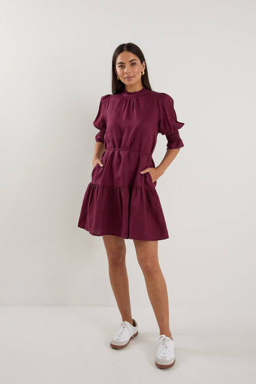 Shop Sable Burgundy Linen High Neck Tiered Mini Dress | Flo & Frankie Shop Sable Burgundy Linen High Neck Tiered Mini Dress | Flo & Frankie