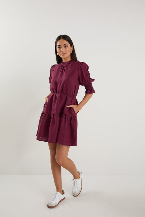 Shop Sable Burgundy Linen High Neck Tiered Mini Dress | Flo & Frankie Shop Sable Burgundy Linen High Neck Tiered Mini Dress | Flo & Frankie