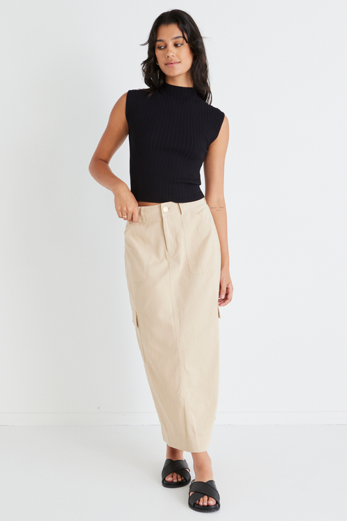 model wears a beige midi skirt