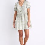 Model wearing a khaki striped puff sleeve mini dress with a V-neckline, puff sleeves, and a tie detail at the front.