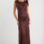 Woman wearing a brown evening gown on a white background