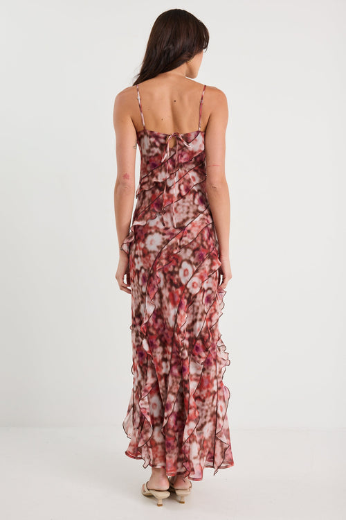 Woman wearing a floral dress on a white background