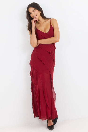Woman wearing a red dress against a white background