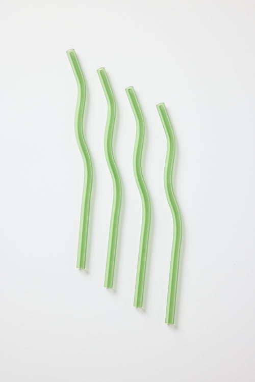 four green curvy glass straws