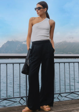 model wears black linen pants