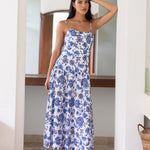 model wearing a blue white floral print maxi dress