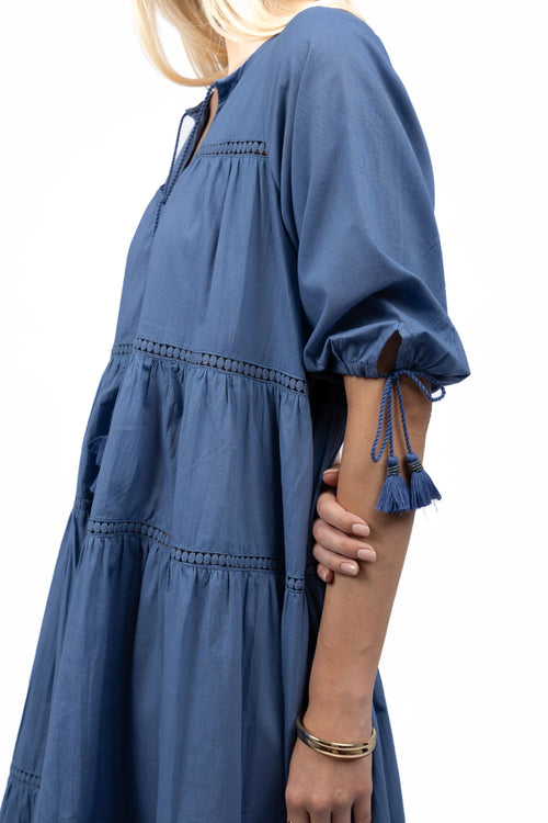 Woman wears a navy blue maxi dress