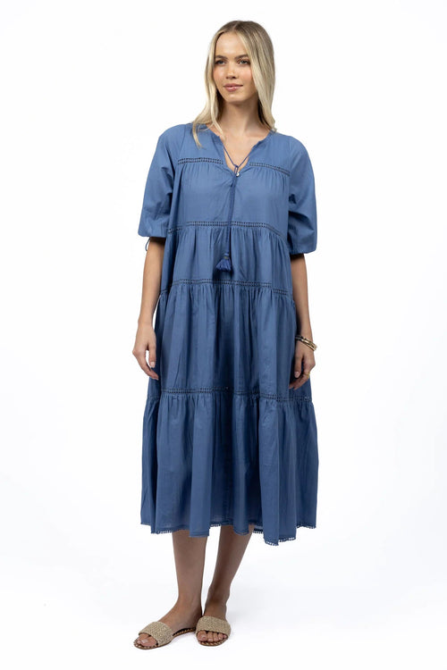 Woman wears a navy blue maxi dress