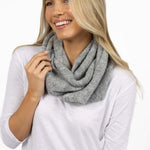 Woman wearing a gray scarf on a white background
