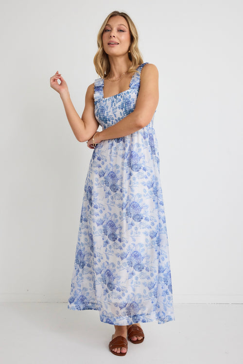  model wears a blue floral maxi dress