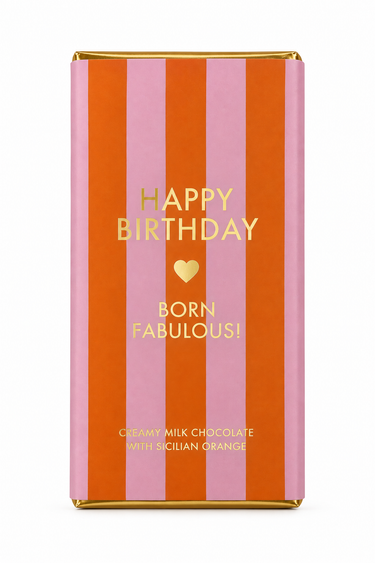A wrapped chocolate bar in a pink and orange striped wrapper with gold foil text reading 'HAPPY BIRTHDAY BORN FABULOUS!' on a white background.