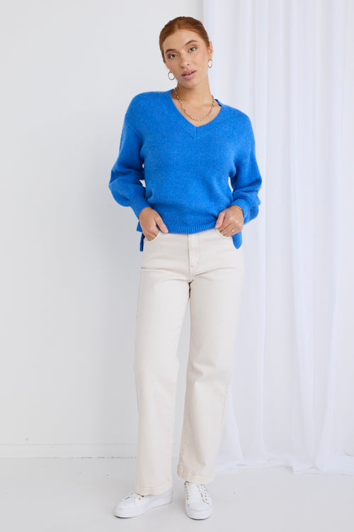 model wears a blue knit jumper