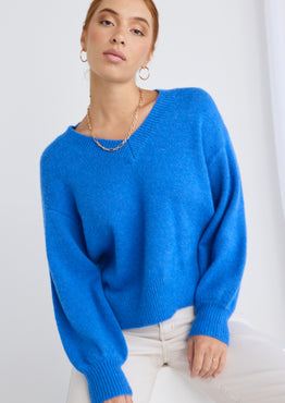 model wears a blue knit