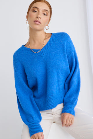 model wears a blue knit